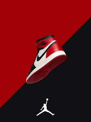 Air Jordan 1 High OG Chicago Colorway Sneaker on Red and Black Diagonal Background HD phone wallpaper