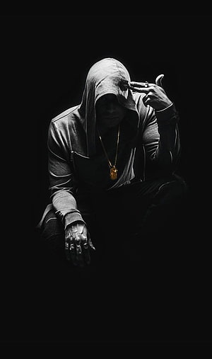 Stefan Mara in a dark hooded portrait with a gold chain and cigarette HD phone wallpaper