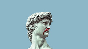 Marble Greek Statue Head with Red Paint Detail on Blue Background HD wallpaper