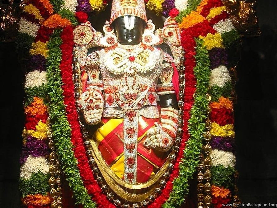 Lord Venkateswara Swamy adorned in vibrant floral garlands and traditional temple jewelry HD wallpaper