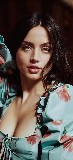 Anya Taylor-Joy in a Teal Floral Dress with Ruffled Sleeves and Intense Gaze HD phone wallpaper