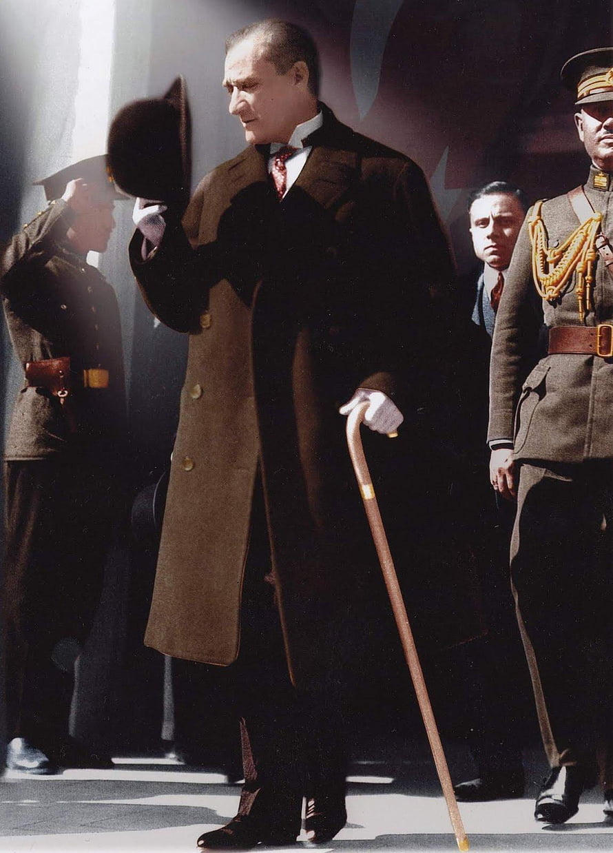 Benito Mussolini in a brown overcoat holding a cane and hat HD phone wallpaper