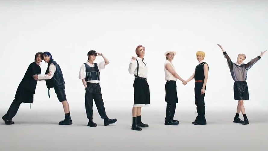 BTS members in black and white outfits posing against a plain white studio backdrop HD wallpaper