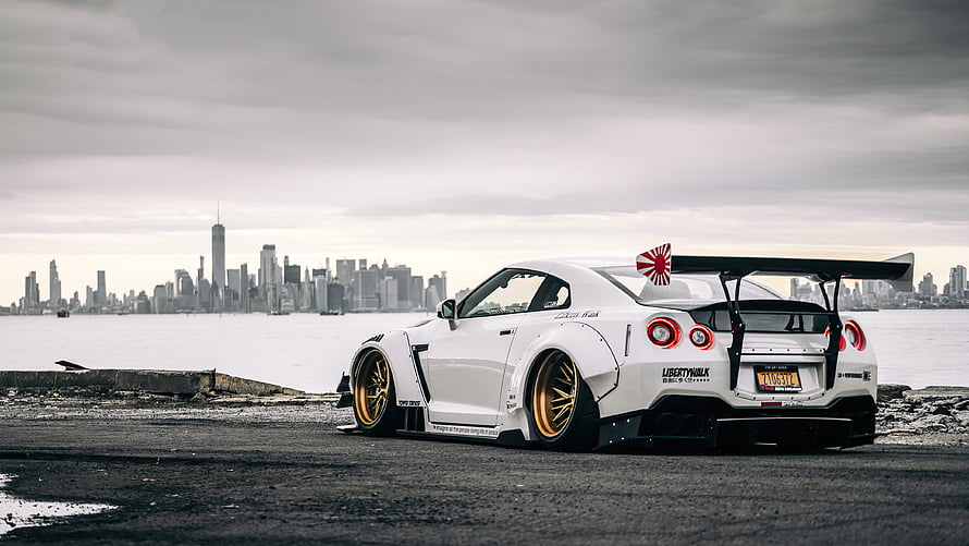Liberty Walk Nissan Skyline R34 GT-R Widebody with Gold Wheels and Rear Wing HD wallpaper