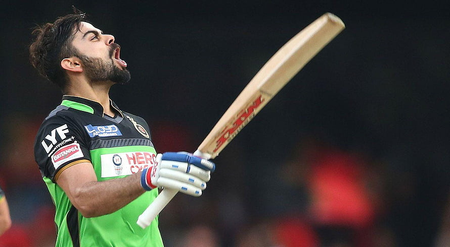 Virat Kohli celebrating a century in Royal Challengers Bangalore green and black kit HD wallpaper