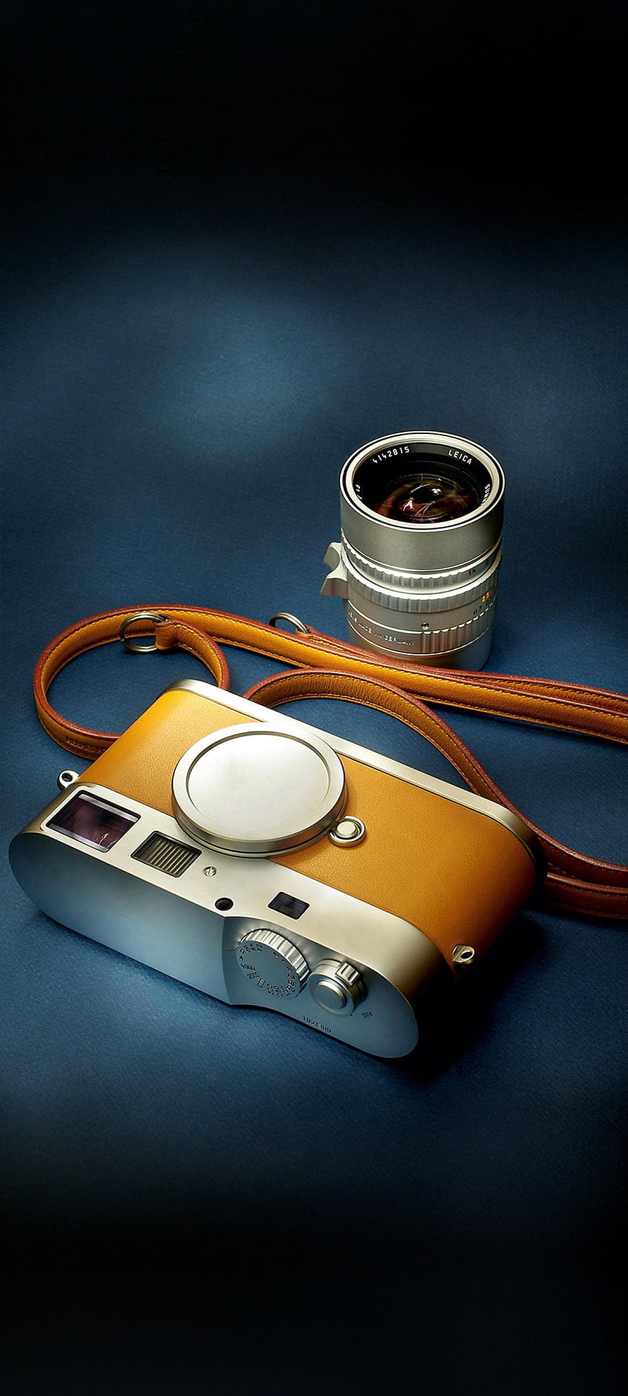 Leica M11 Camera with Summilux Lens and Leather Strap on Blue Background HD phone wallpaper