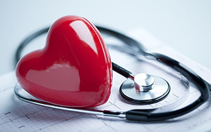 Red Heart Model and Stethoscope on ECG Paper for Medical Care HD wallpaper