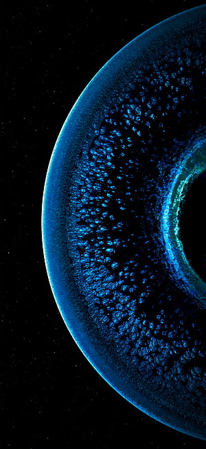Glowing Blue Celestial Sphere with Textured Surface Against Starry Black Space HD phone wallpaper