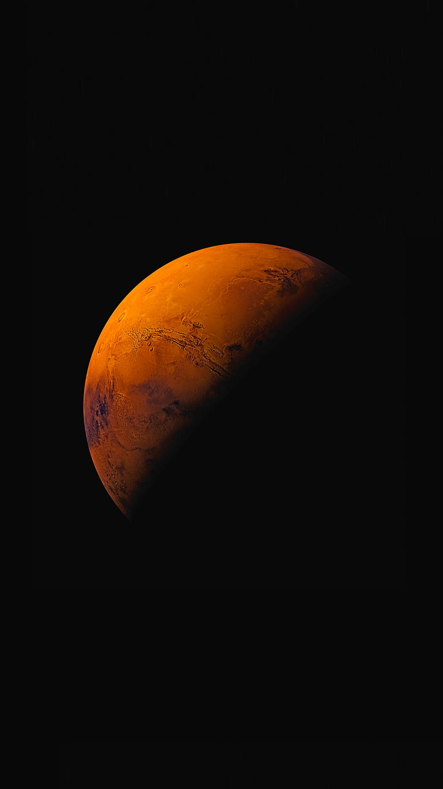 Mars Planet in Deep Space with Dramatic Orange Illumination and Dark Void Background HD phone wallpaper