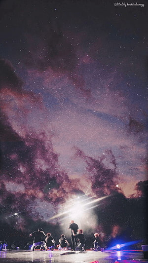 BTS Concert Stage Under a Starry Purple Nebula Sky HD phone wallpaper