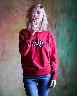 Blonde Woman in Red Gap Sweatshirt and Blue Jeans Against Colorful Wall, Eva Elfie – The Man from Vincentown, #eva elfie HD phone wallpaper