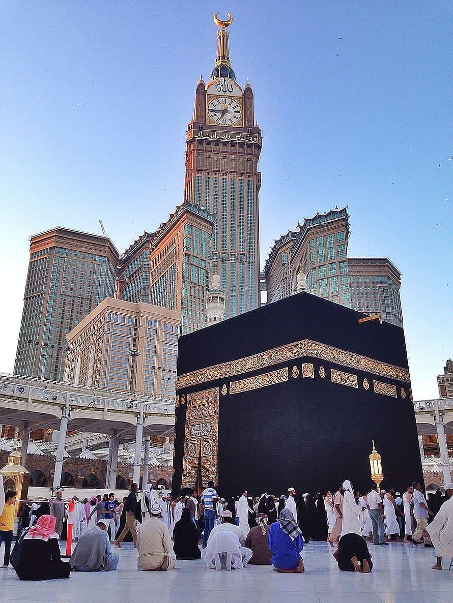 Kaaba and Abraj Al Bait Clock Tower in Mecca with Pilgrims Praying HD phone wallpaper