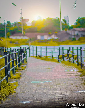 Rainy Paved Pathway With Black Fences And Greenery HD phone wallpaper