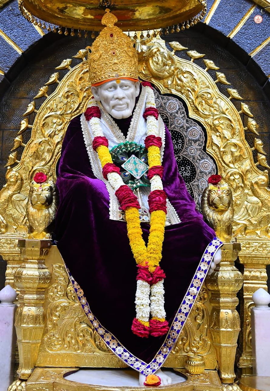 Sri Sathya Sai Baba Statue on Golden Throne with Flower Garlands HD phone wallpaper