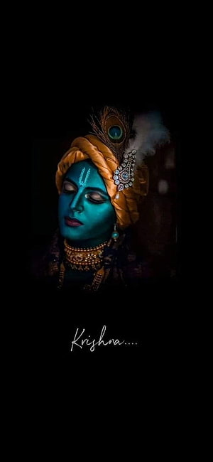 Serene Blue Skinned Krishna Portrait With Peacock Feather Crown HD phone wallpaper