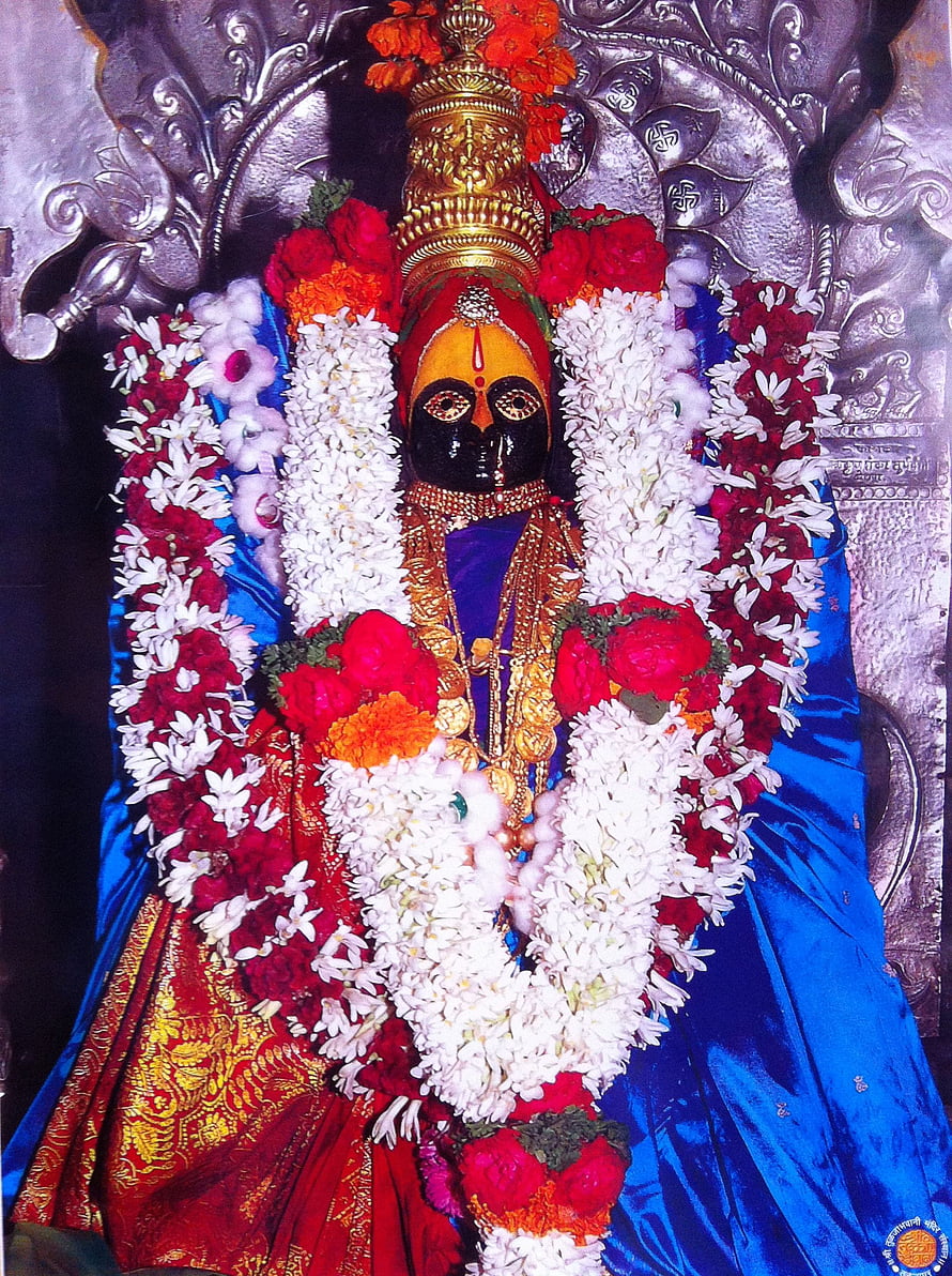 Tulja Bhavani Murti Adorned With Vibrant Floral Garlands And Traditional Temple Attire HD phone wallpaper