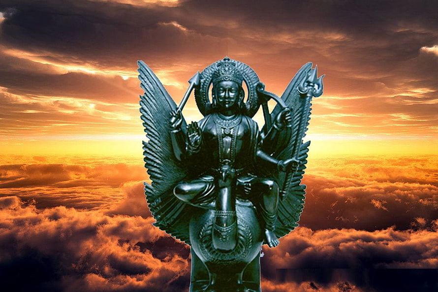 Lord Shani Dev Statue With Wings Against Dramatic Sunset Clouds HD wallpaper