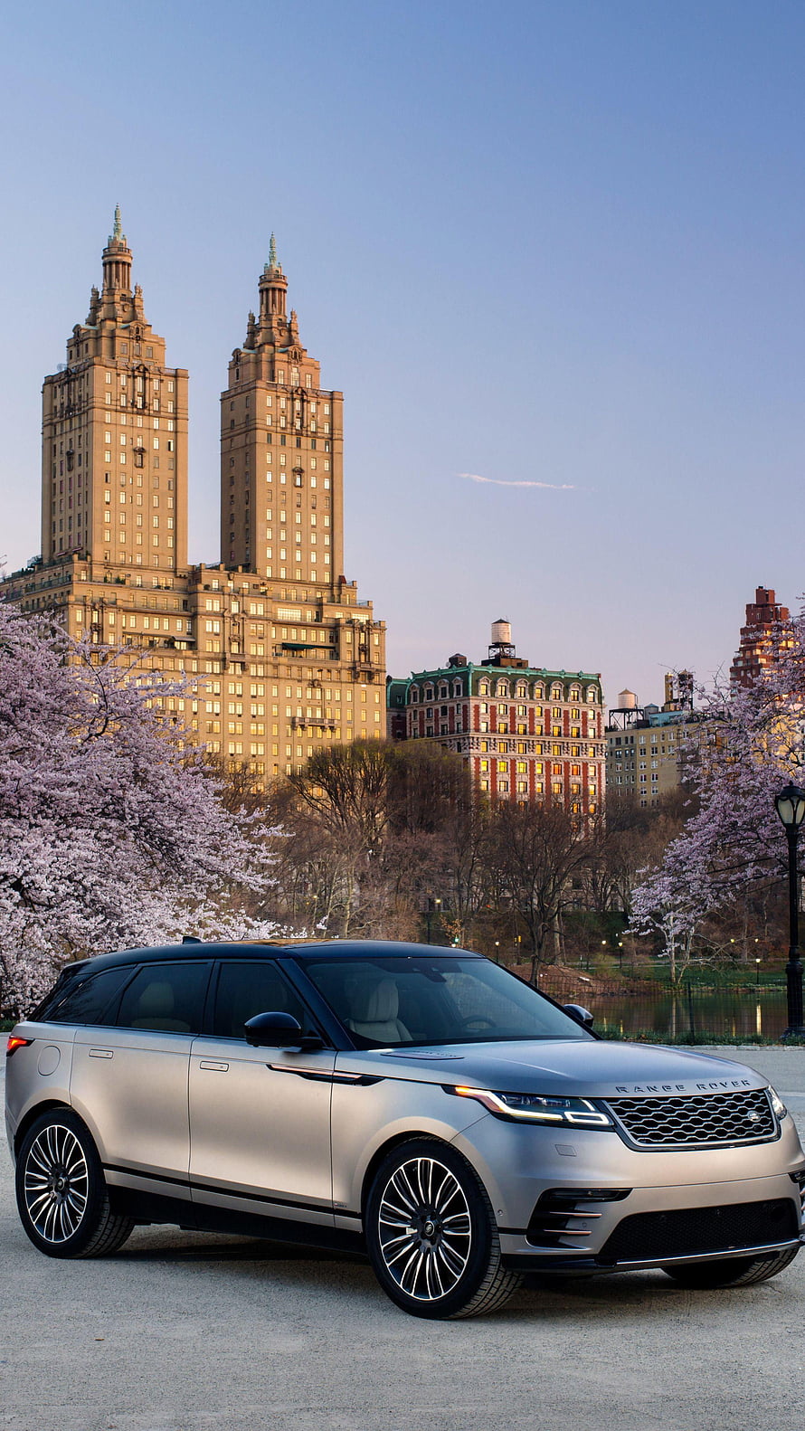 Silver Range Rover Velar Parked in Central Park with Cherry Blossoms and New York Skyline HD phone wallpaper