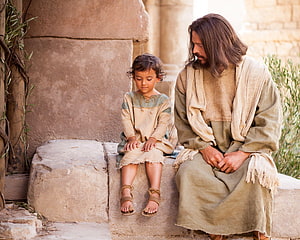 Jesus and Child in Ancient Biblical Setting with Stone Architecture HD wallpaper