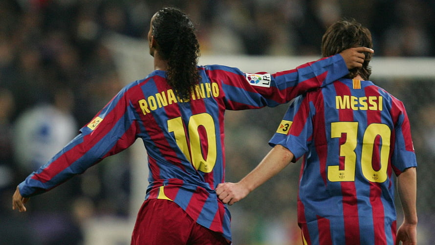 Ronaldinho and Lionel Messi in Barcelona Striped Kits on the Pitch HD wallpaper