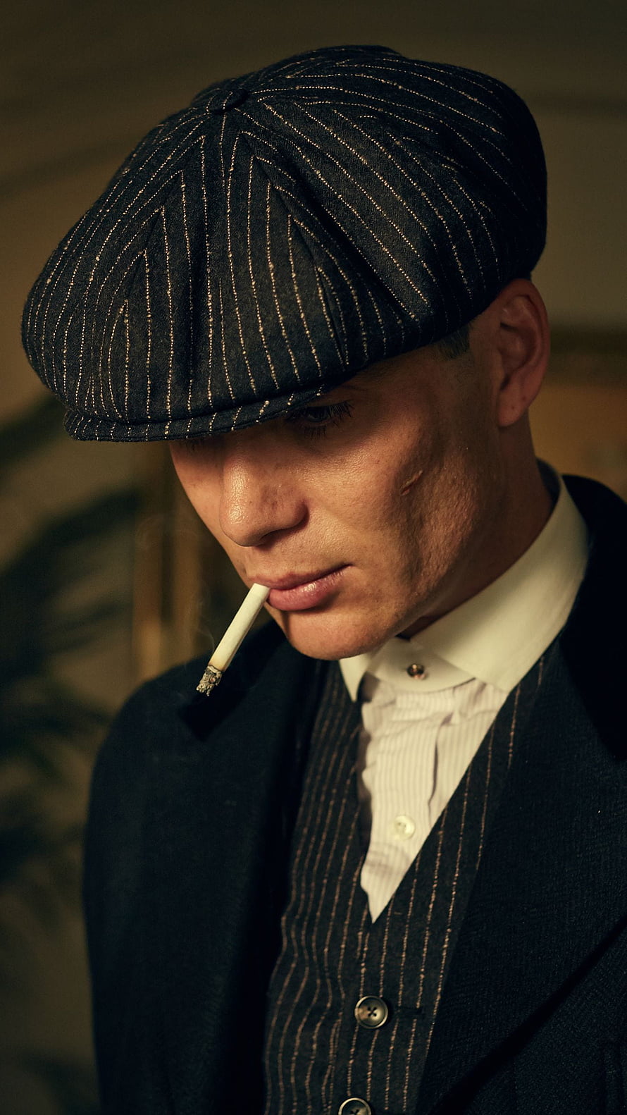 Thomas Shelby from Peaky Blinders in a pinstripe flat cap and suit with a cigarette HD phone wallpaper