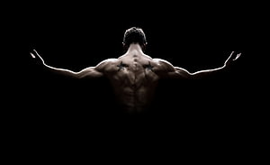 Muscular Male Back View With Star Tattoos Against Black Background HD wallpaper