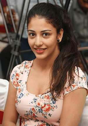 Vishakha Singh smiling portrait wearing a pink floral top with dark hair HD phone wallpaper