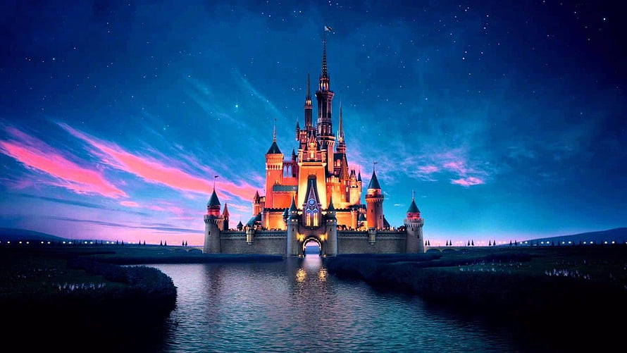 Magical Disney Castle at Night with Glowing Lights and Starry Sky HD wallpaper