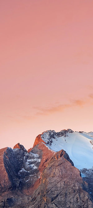 Snow-Capped Mountain Peaks Bathed in Pink Sunset Light HD phone wallpaper