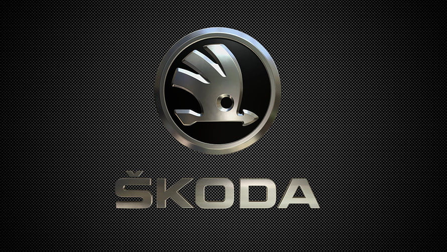 Skoda Automotive Emblem on Dark Carbon Fiber Texture HD wallpaper