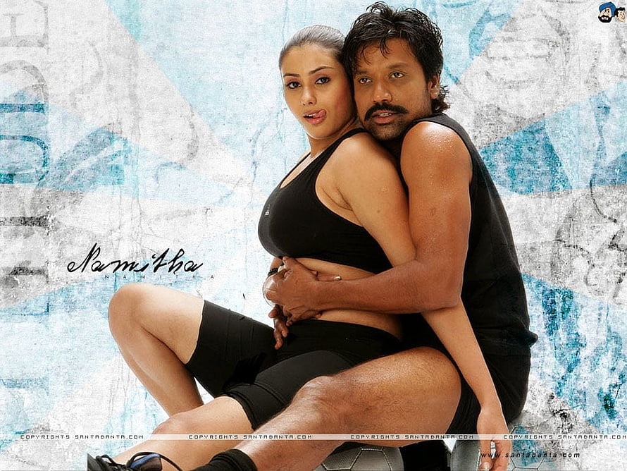 Namitha and Suri in Black Athletic Wear Embracing on a Soccer Ball HD wallpaper