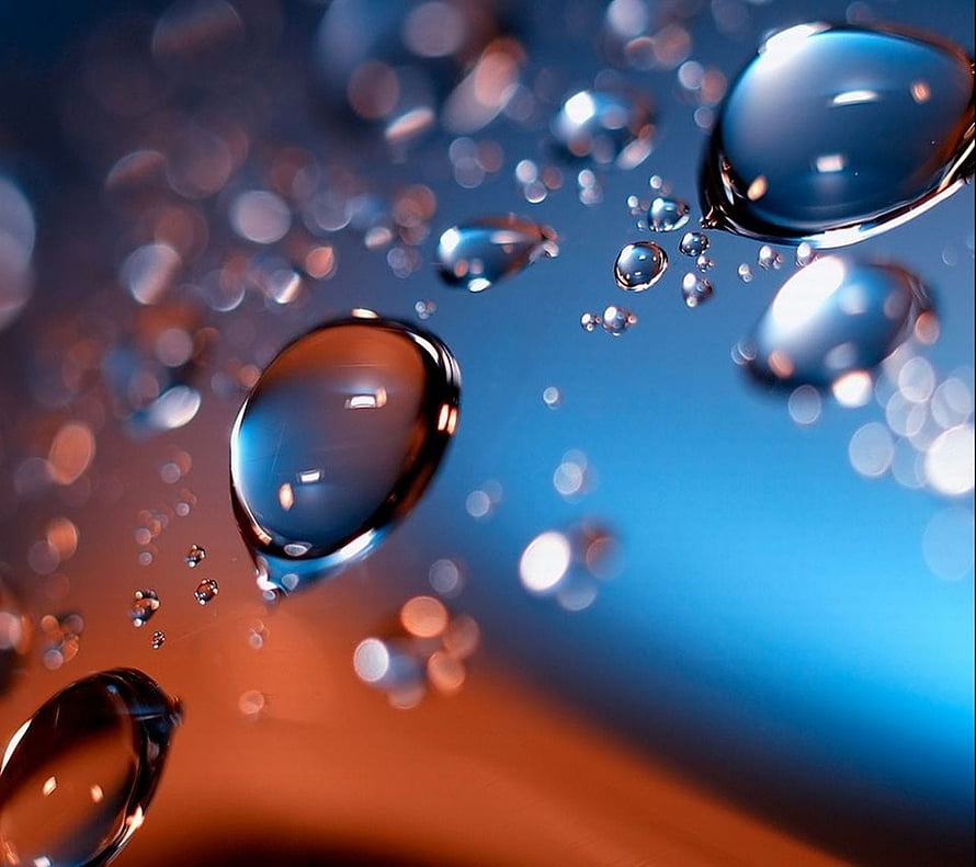 Macro Water Droplets on a Blue and Orange Gradient Surface HD wallpaper