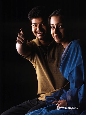 Vishal and Trisha posing together in a dramatic portrait with dark background HD phone wallpaper