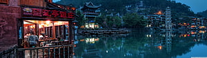 Fenghuang Ancient Town Riverside Night View with Traditional Chinese Architecture and River Reflections HD wallpaper