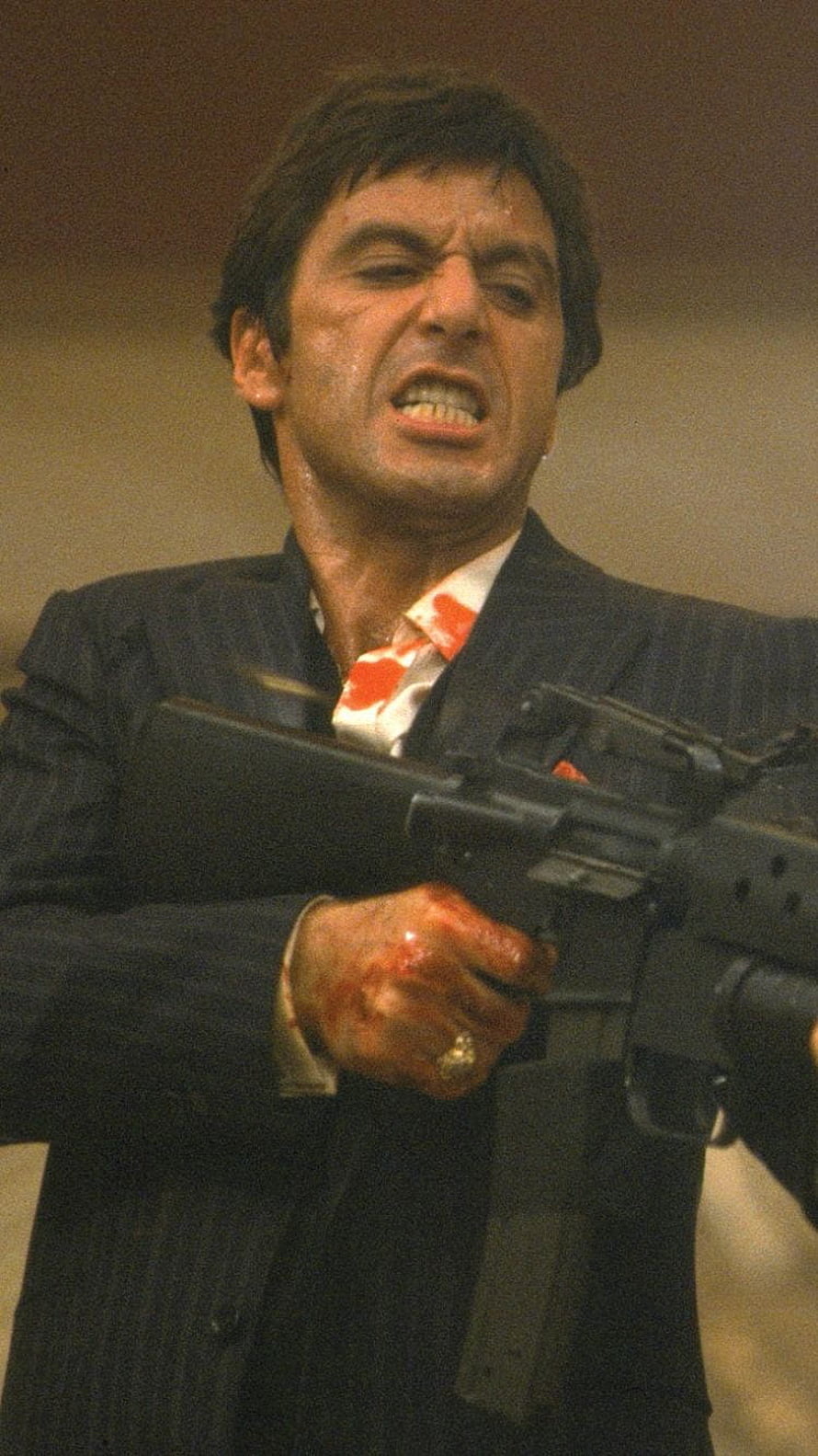 Tony Montana in Scarface Holding an Automatic Rifle in a Dark Pinstripe Suit HD phone wallpaper