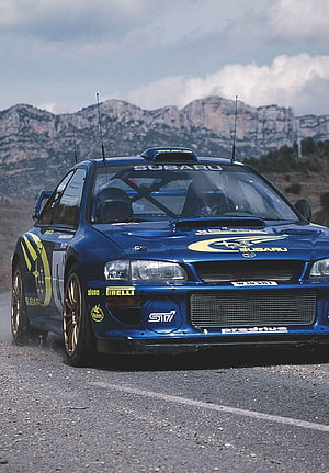 Blue Subaru Impreza WRC Rally Car on Mountain Road with Colin McRae Livery HD phone wallpaper