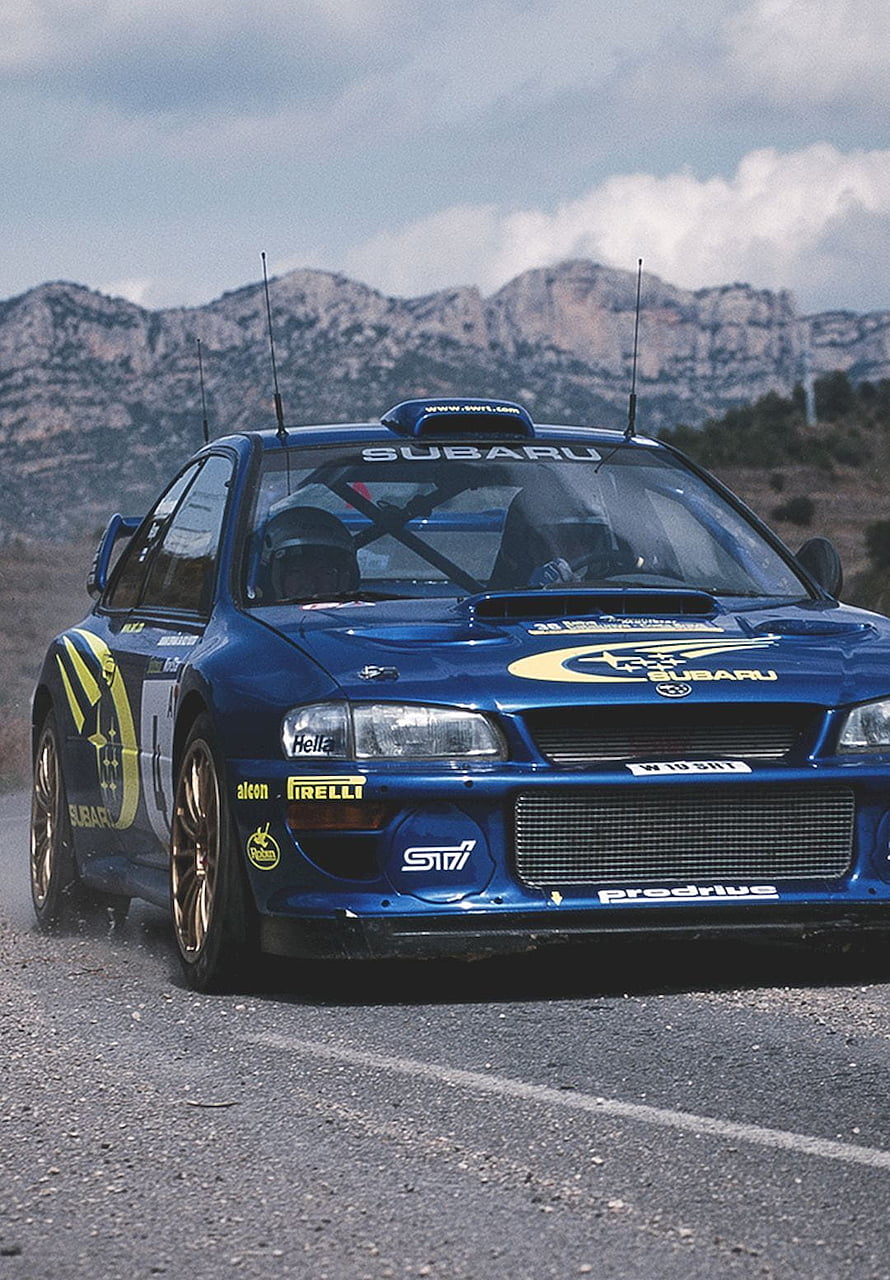 Blue Subaru Impreza WRC Rally Car on Mountain Road with Colin McRae Livery HD phone wallpaper