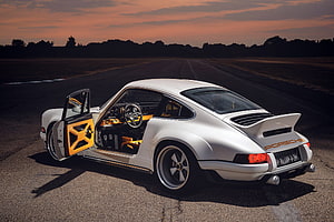 Singer DLS by Porsche: White Classic 911 with Orange Interior on Sunset Runway HD wallpaper