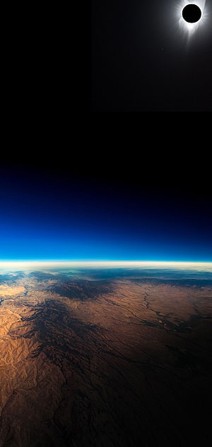 Total Solar Eclipse Over Earth's Curved Horizon From Space HD phone wallpaper