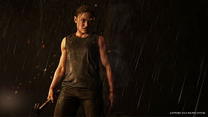 Abby Anderson from The Last of Us Part II standing in heavy rain holding a weapon in a dark cinematic scene HD wallpaper