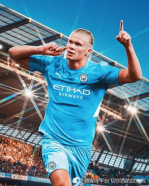 Erling Haaland in Manchester City Sky Blue Kit Celebrating Goal at Etihad Stadium HD phone wallpaper