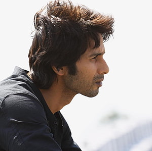 Kabir Singh Profile Portrait in Black Shirt with Windblown Hair HD wallpaper