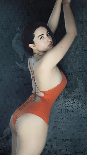 Woman in Orange Swimsuit Posing Against Vintage World Map Background, Aditi Budhathoki Hot hoot HD phone wallpaper
