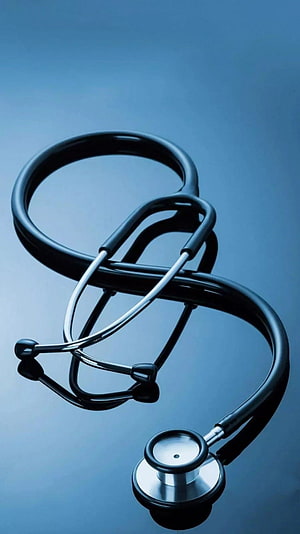 Black Stethoscope on Blue Background Medical Equipment Close Up HD phone wallpaper