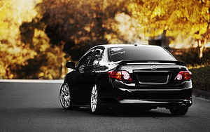 Black Toyota Corolla AE101 Sedan Rear View on Autumn Road HD wallpaper