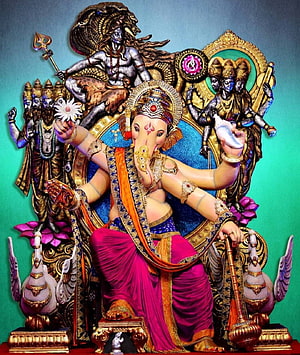 Vibrant Ganesha Statue with Shiva and Parvati Background HD phone wallpaper