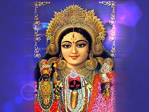 Maa Durga Hindu Goddess Portrait with Ornate Crown and Sacred Symbols HD wallpaper