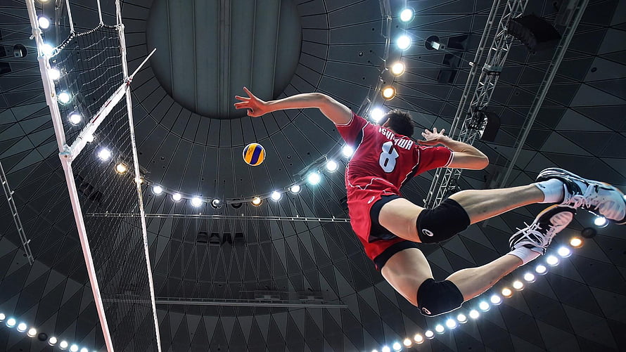 Japanese Men's Volleyball Player Executing Aerial Spike Attack HD wallpaper