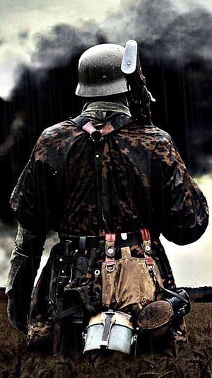 WWII German Soldier in Camouflage Standing in Rain with Smoke, German Soldiers, ww2 germany HD phone wallpaper