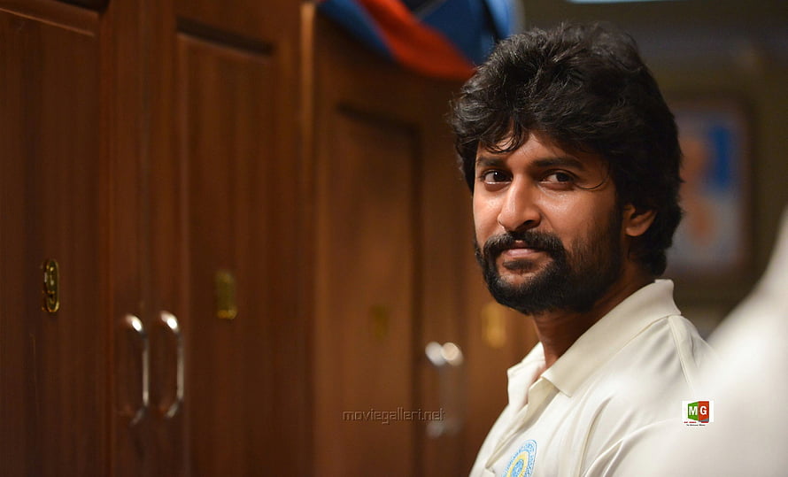 Allu Arjun in white cricket jersey looking back in locker room scene from Pushpa 2 The Rule HD wallpaper